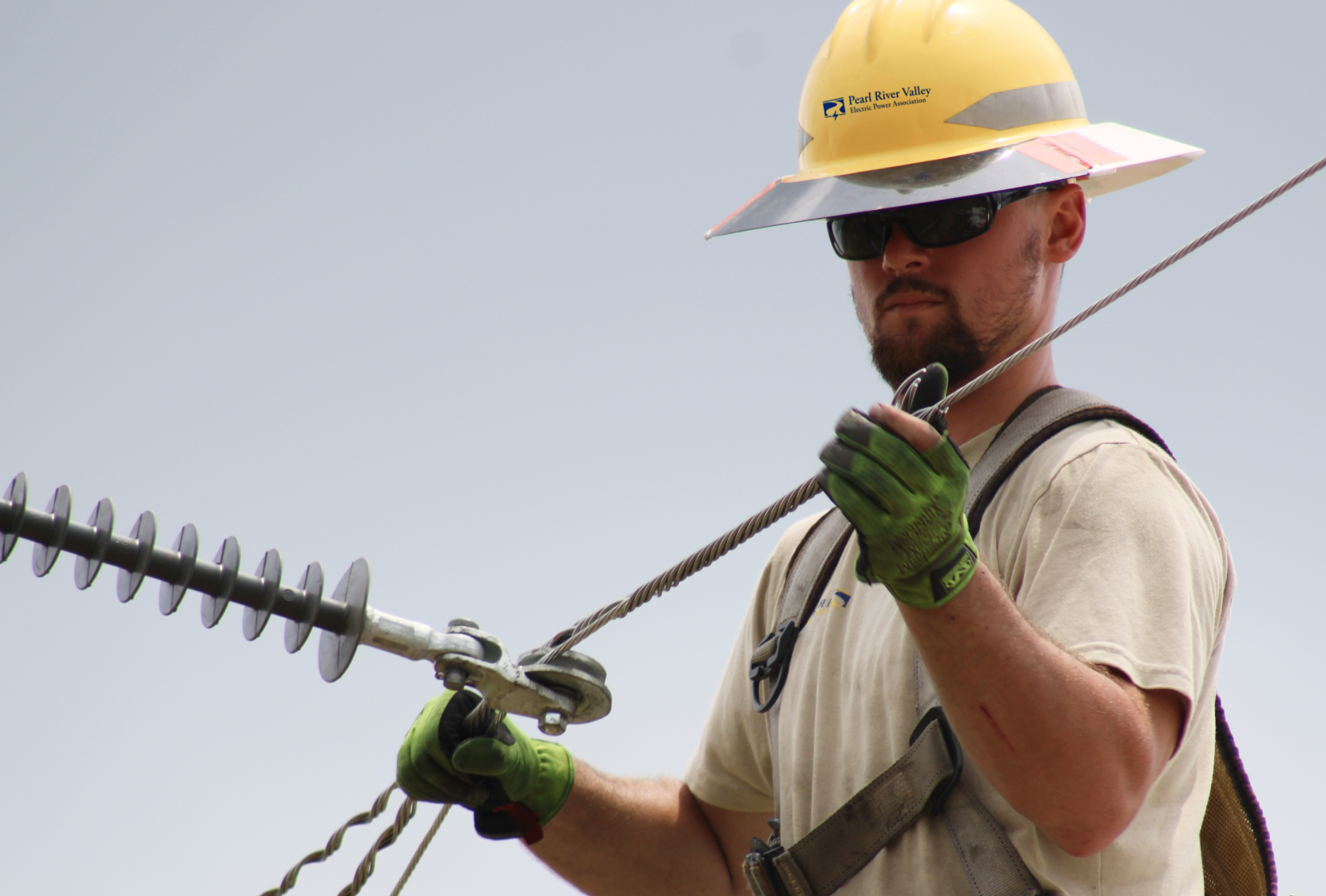 picture of pearl river valley employee working on electric line 